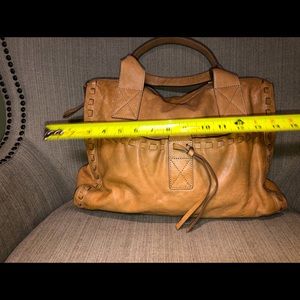 This Buff/tan leather handbag is the softest leather I have ever felt